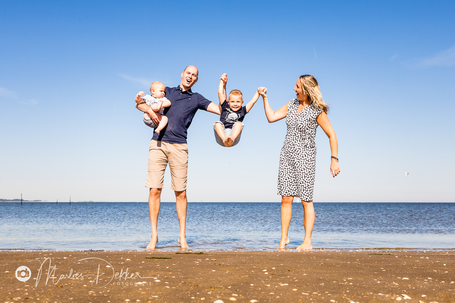familie fotoshoot op het strand